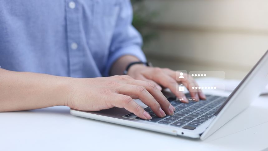 close up developer man hand type keyboard input username and password for register system software on laptop in operation office room for cyber security technology concept
