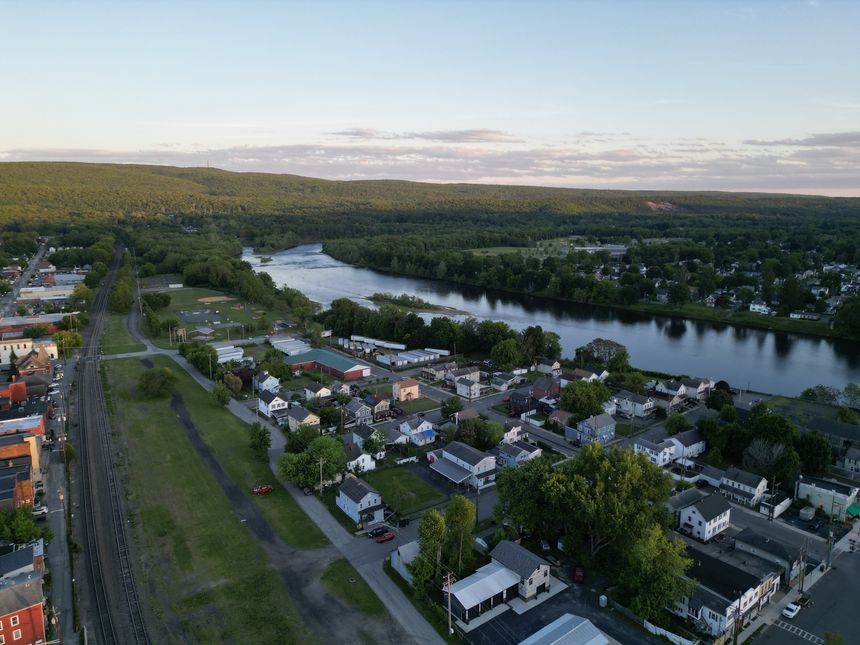 aerial view of port jervis new york on delaware river at sunset tri state line jersey Pennsylvania church tower mountains