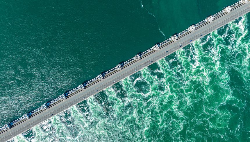 Delta Dam Project in Netherlands. Top dron view of Oosterschelde Barrier, storm surge barrier. Delta Works flood protection system.