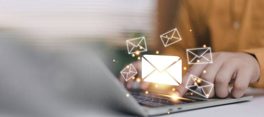 Email communication concept with glowing envelope icons over laptop keyboard. Online messaging, digital marketing, business connection, customer engagement and modern technology workflow.