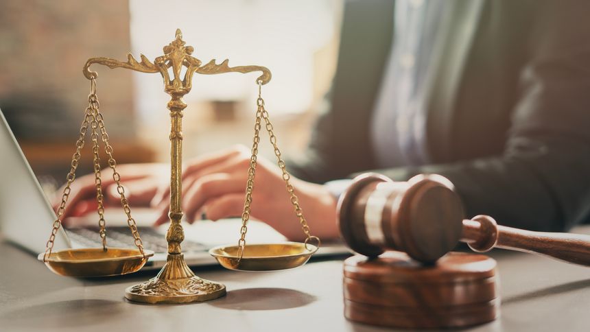 Lawyer using laptop in office