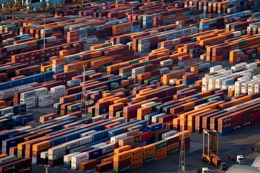 Barcelona, Spain - 18th July 2025: Shipping containers and cargo ships are seen in the port. Concept of trade war and maritime trade and tariffs