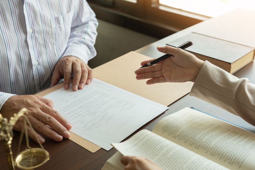 law and legal services concept. judge consult and women lawyer or attorney having team meeting with client at legal firm.