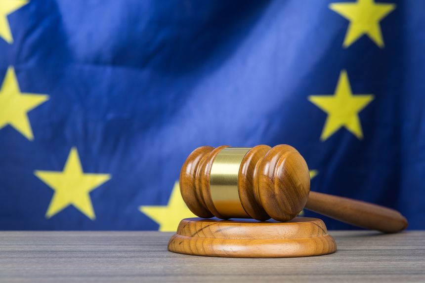 Court gavel with European Union flag in the background