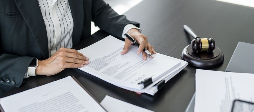 Lawyer businessman working with lawbook in office or courtroom Legal counsel with gavel and legal law. justice and lawyer concept Judge gavel hammer on Lawyer desk