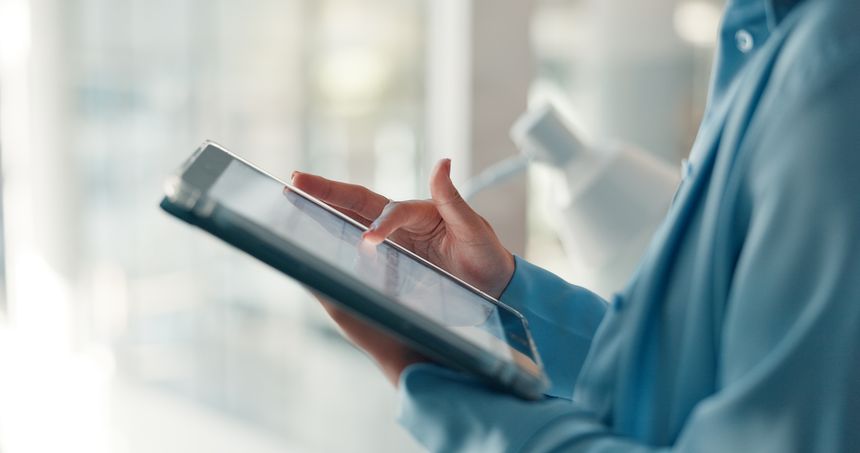 Hands, tablet and scroll with business woman in office for planning, magazine editor and research. Media publication, website and article feedback with person in creative agency for newsletter draft