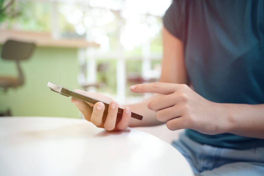 Asian woman using smartphone mobile addict spending time checking news social media cell telephone technology e-commerce concept