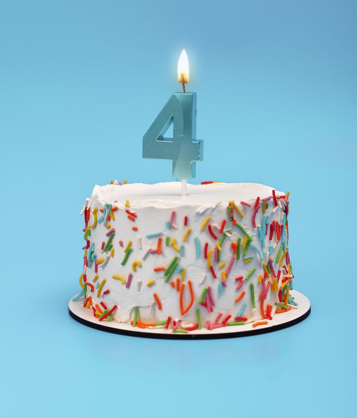 Cake with four candles for 4th birthday party. Happy celebration with blue white background. Decorated sweet bakery, buttercream dessert. Fun number, cute baked minimal. Cream celebrate, gift flame