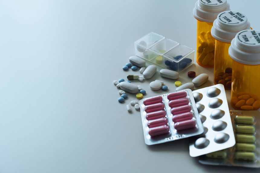 Medicine bottle and pill with blister packaging used in pharmacy and health care. Ideal of drug treatment, supplement or vitamin and pharmaceutical marketing and industry. Healthcare concept