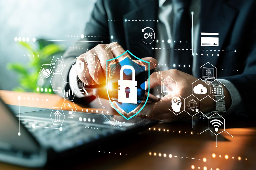 Businessman using smartphone with digital shield lock interface, securing online banking, payments and cloud data. Concept of cybersecurity, privacy, authentication and network protection.