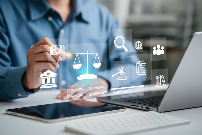 Hand of the businessman or Lawyer with legal services icon on the laptop screen for Legal advice online in Labor law for a business company legal. concept of legal consultant and lawyer