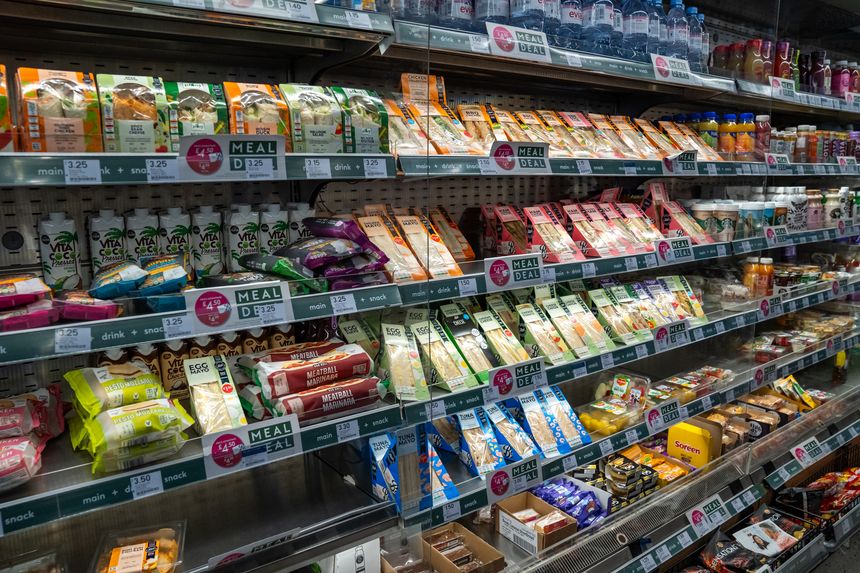 London, England, 11 July 2023, A Supermarket Shelf Displays Pre Packaged Sandwiches, Snacks, and Beverages, Offering Quick Meal Deals for Shoppers.