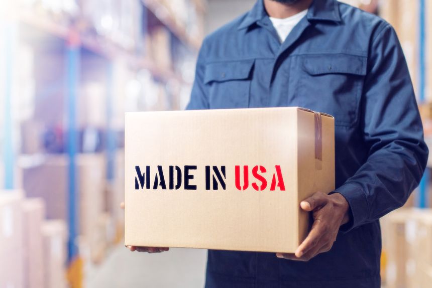 A worker in the warehouse and a package labeled Made in US