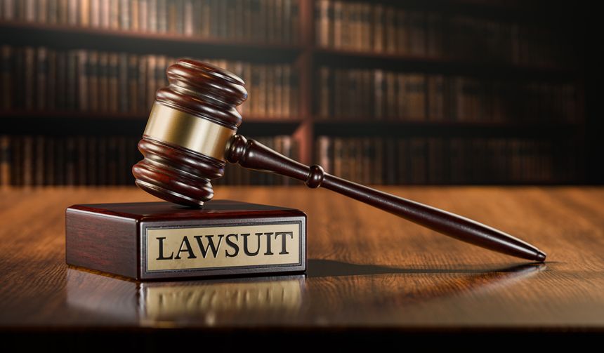 Lawsuit: Judge's Gavel as a symbol of legal system and wooden stand with text word.