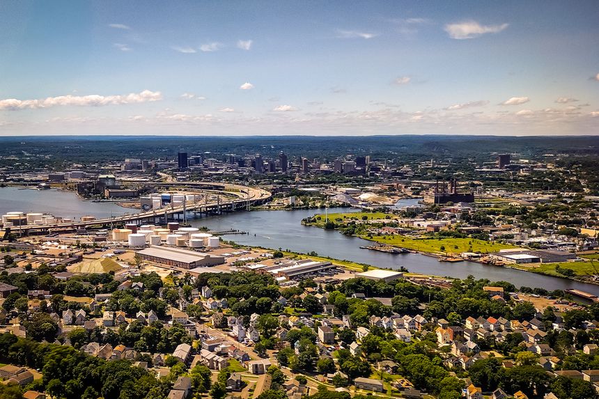 A stunning aerial stock photo of New Haven, Connecticut, showcasing the city's layout, architecture, and surrounding landscape from above. The image captures the urban and natural elements of the area, making it ideal for use in cityscapes, travel, and regional projects