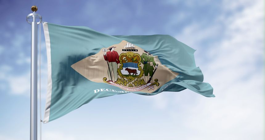 Delaware state flag waving on a clear day. Colonial blue background with a buff-colored diamond and state coat of arms, and December 7, 1787 below it. 3d illustration render. Fluttering fabric