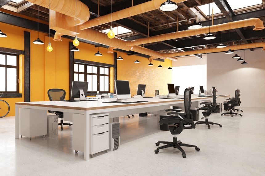 Office: desks with computers chairs. Beams steel orange ducts. Brick wall. Windows skylights pendants. Concrete floor. Co-working space. 3D photoreal rendering.