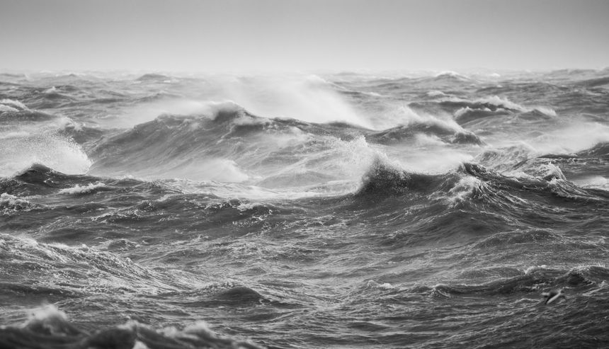 A storm whips up the sea creating rough waves and lots of spray