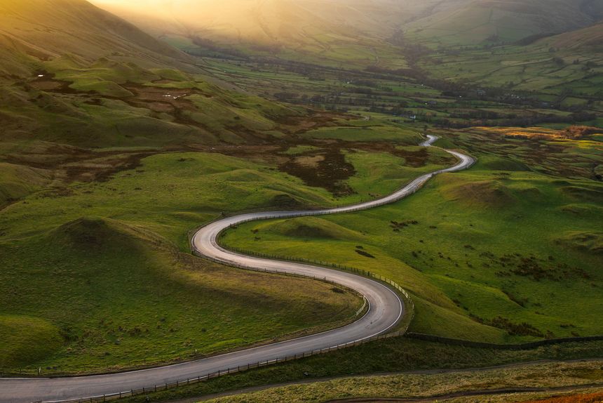 Rural road leading to Edale, seen from Mam Tor in The Peak District, UK.