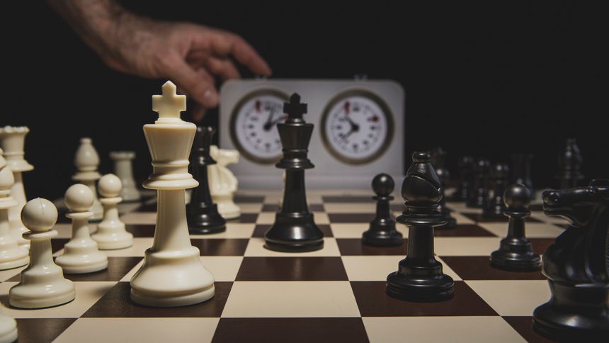 Adult man playing chess on a tournament