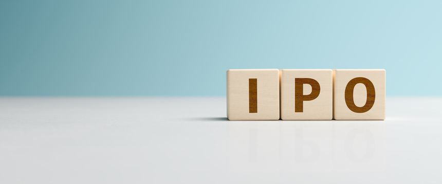 Wooden toy cubes forming the abbreviation 