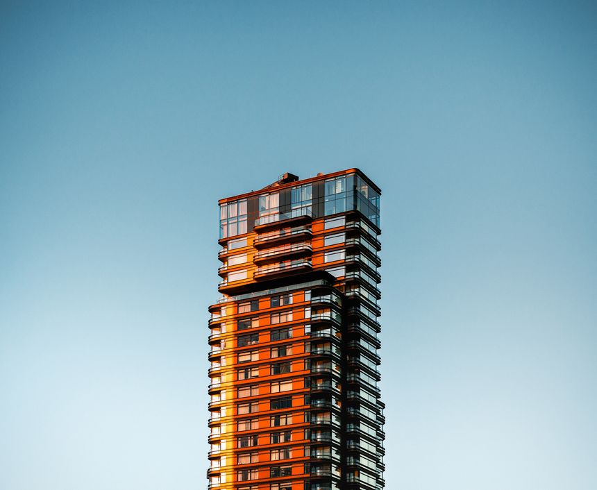Lone building against a blue sky as the sun sets