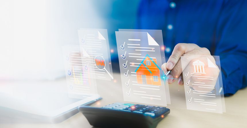 Homes and Residences Documents related to residential building loans through banks, including government tax refunds and tax deductions. Businessman using calculator and laptop