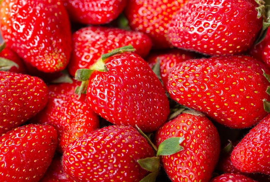 close up of fresh strawberries as background, top view