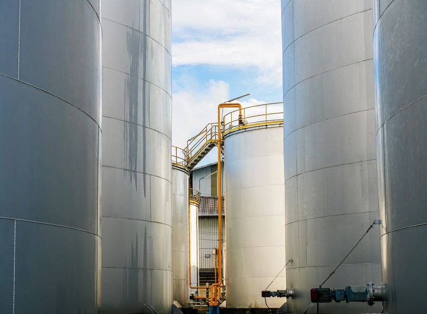 Aerial view Oil storage tank In industrial areas. Crude oil storage plant For export. Palm oil factories in Asia. Within the industrial plant. Zone tank storage industrial. Palm plantation