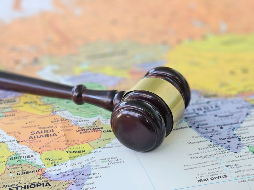 he gavel marks the countries and regions of the Middle East and Europe. World map and justice and judicial world system