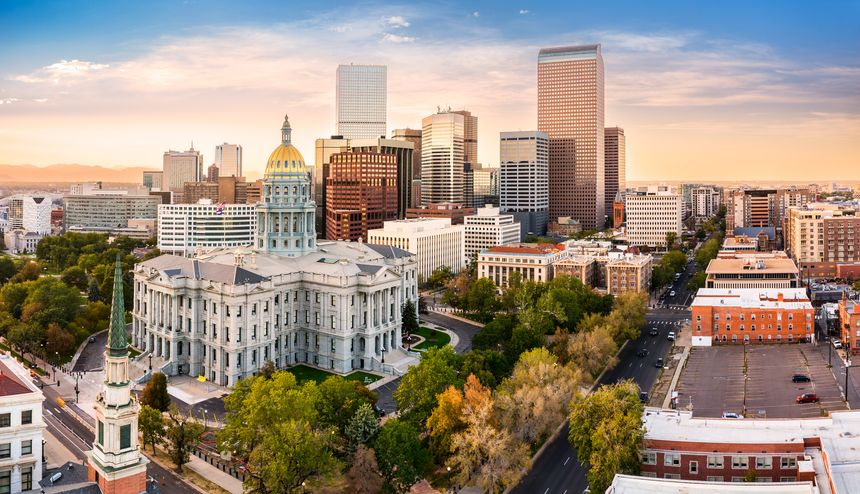 Aerial view of Colorado Capitol and Denver, Colorado skyline at sunset. Denver is a consolidated city and county, the capital, and most populous city of the U.S. state of Colorado