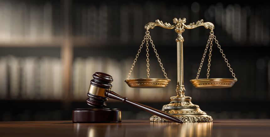 Legal concept: Scales of justice and and the judge's gavel hammer as a symbol of law and order.