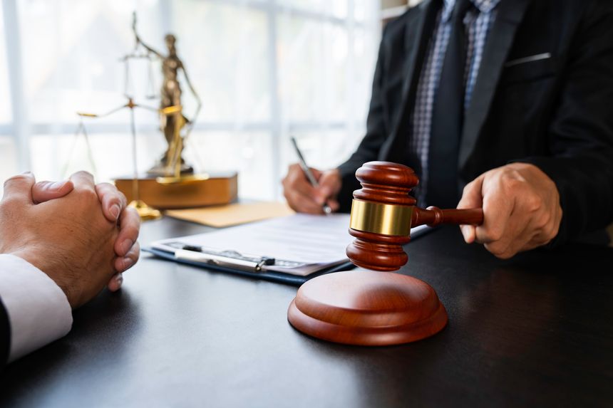 Lawyer or judge holding Hammer prepares to judge the case with justice, and litigation, scales of justice, law hammer, Legal consulting services, Concept of litigation, and legal services.