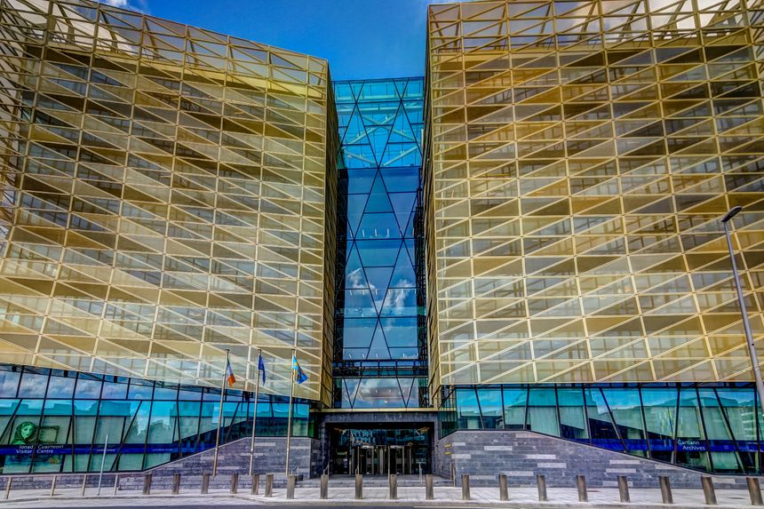 Dublin, Ireland - July 11, 2019: Modern architecture of the Central Bank of Ireland along the Liffey River in Dublin Ireland