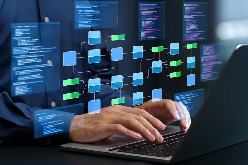 Programmer writing code based on the specifications.