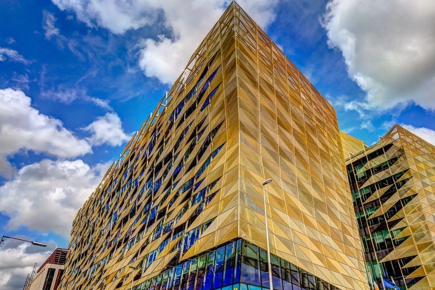 Dublin, Ireland - July 11, 2019: Modern architecture of the Central Bank of Ireland along the Liffey River in Dublin Ireland