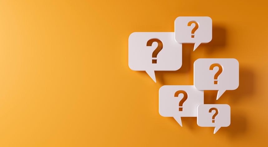 Question mark speech bubbles in front of a yellow wall with copy space - 3D illustration
