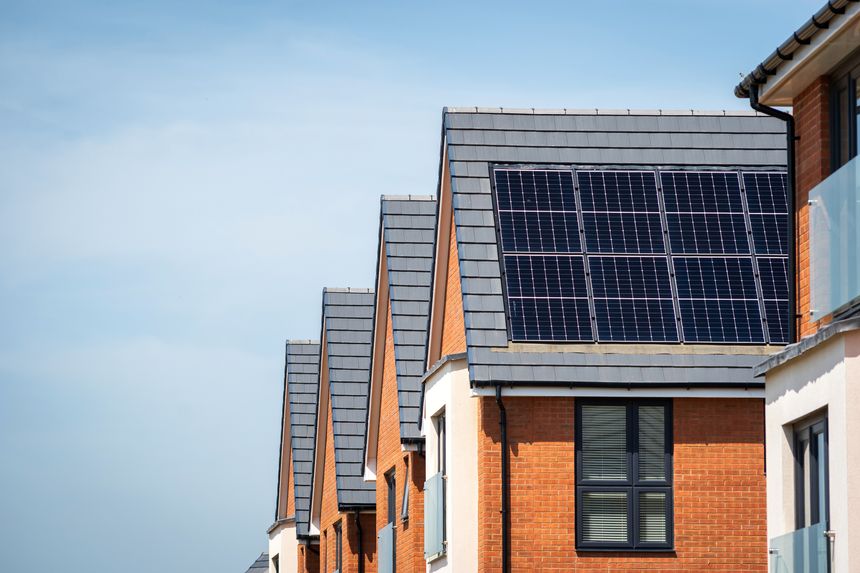 Photovoltaic solar panels on the roof of new built house in england uk. The concept of a sustainable environment, construction.
