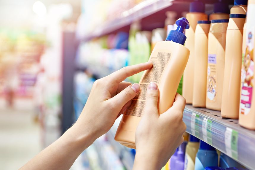 Plastic bottle of shampoo in store