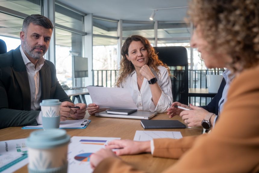 Group of business persons talking in the office