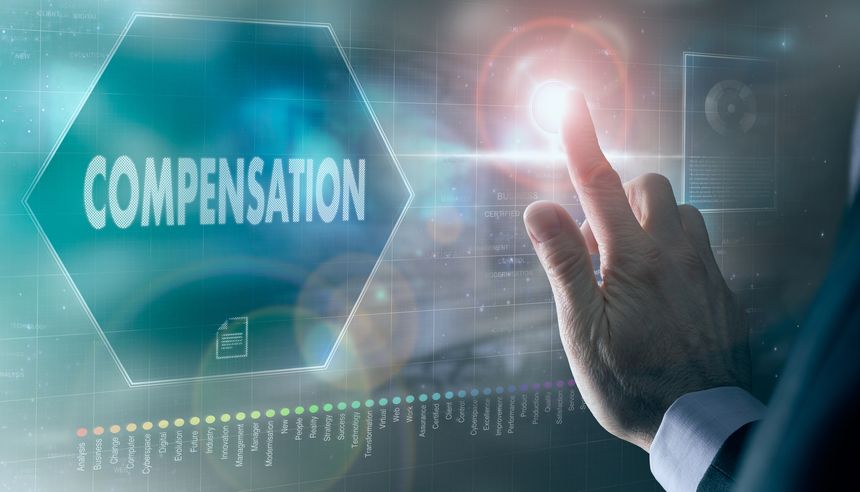 A businessman controlling a futuristic display with a Compensation business concept on it.