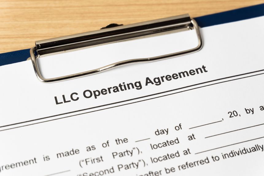 Legal document LLC Operating Agreement on paper close up
