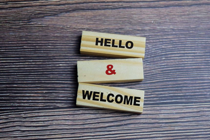 Concept of Hello and welcome Symbol. Wooden block with words Hello and welcome