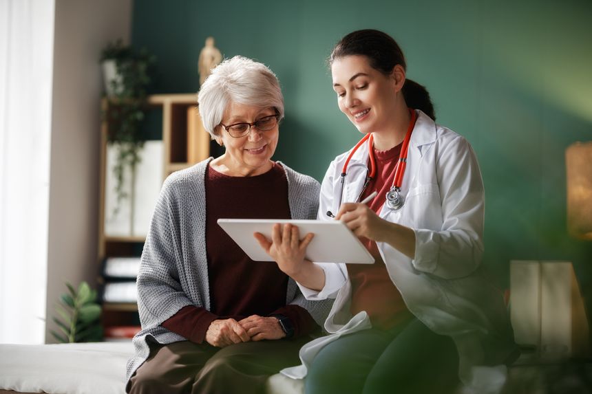 Female patient listening to a doctor in hospital.