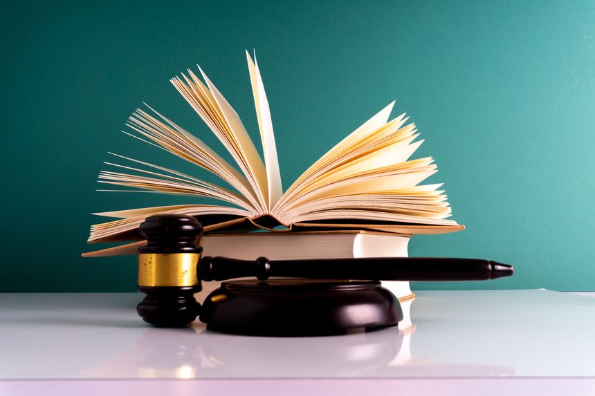 Gavel hammer and book with legally concept.