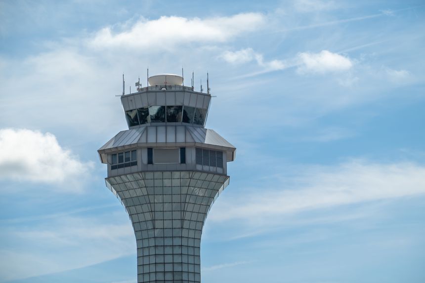Chicago, Illinois, USA. Sep 21, 2025. The Chicago O'Hare airport control tower stands tall against a partly cloudy sky, a vital hub for air traffic management.