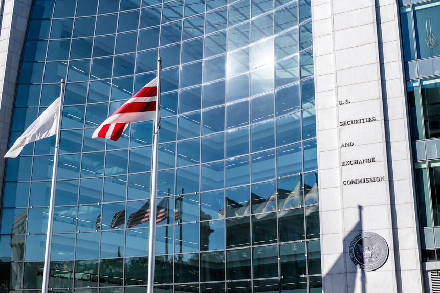 Washington DC, USA - October 12, 2018: United States Securities and Exchange Commission SEC architecture closeup with modern building sign and logo with red flags by glass windows