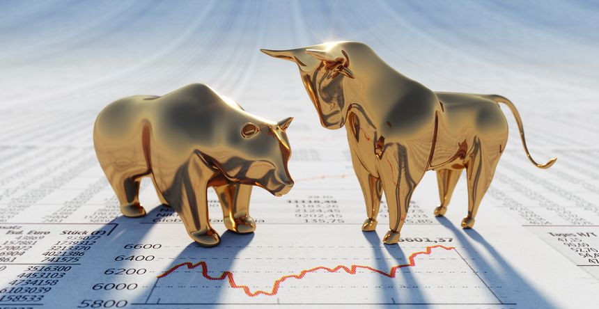 Golden bull and bear figurines on stock market newspaper - 3D illustration