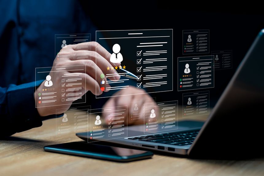 HR management with AI recruiting technology concept: Businessman uses a laptop recruitment process to check the scores and qualifications of applicants through an online system, Best human resource