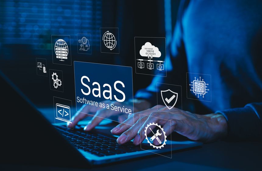 SaaS Software as a Service Digital Cloud Technology. Hands typing on laptop with SaaS icons representing cloud computing, data storage, software integration, security, and service based applications.